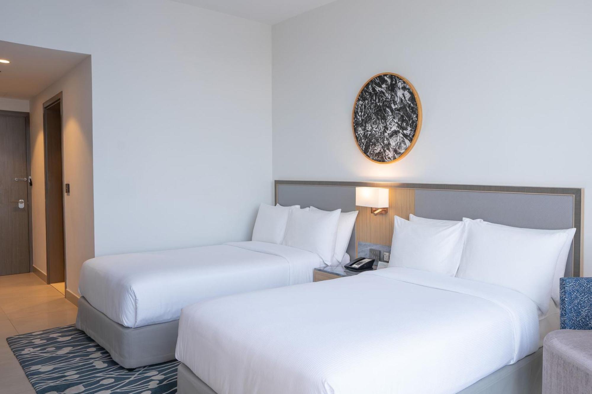 The First Collection Dubai Jumeirah Village Circle, A Tribute Portfolio Hotel By Marriott Exterior foto Two single beds in a hotel room
